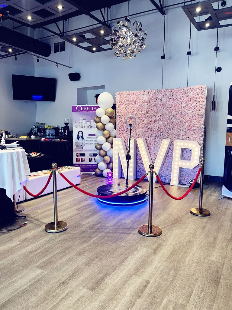 fergus 360 video booth with marquee letters, stanchions and a fergus flower wall